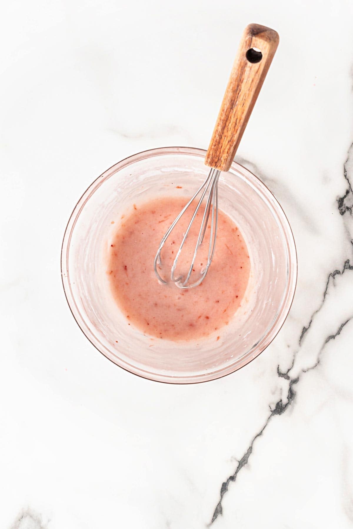 Strawberry glaze whisked smooth in bowl