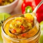 Spoonful of chow chow relish lifted from a mason jar