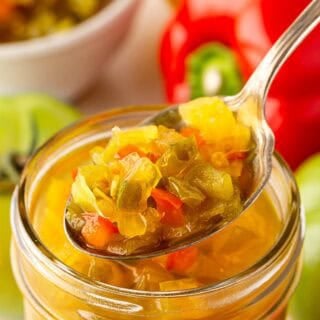 Spoonful of chow chow relish lifted from a mason jar