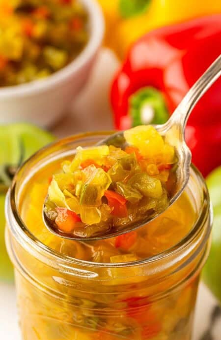 Spoonful of chow chow relish lifted from a mason jar