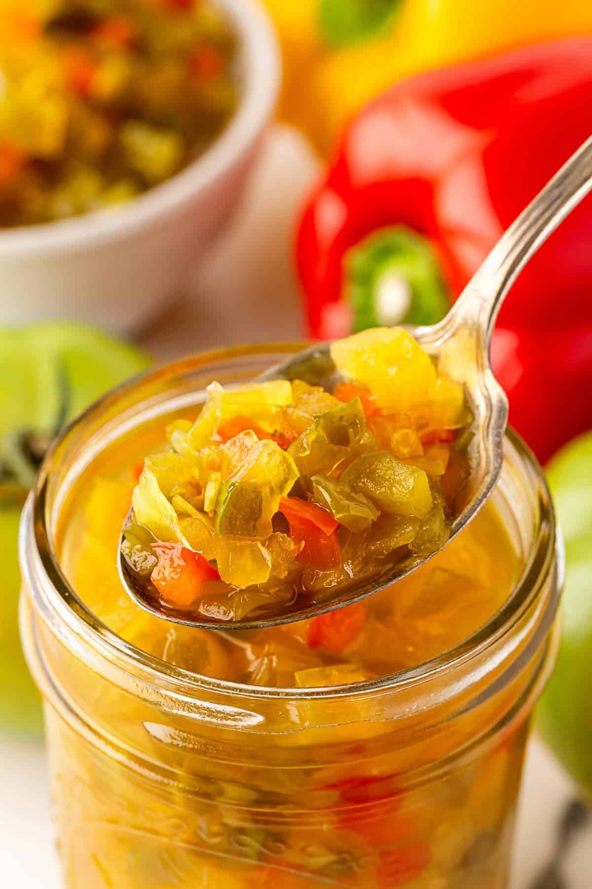 Spoonful of chow chow relish lifted from a mason jar