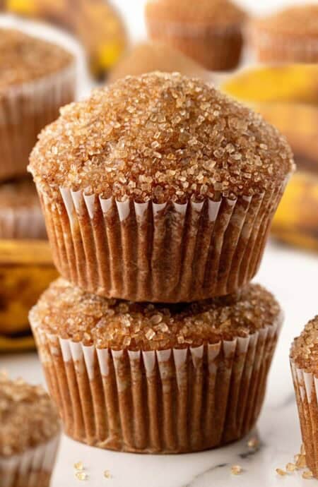 Stack of two banana muffins with crunchy sugar tops