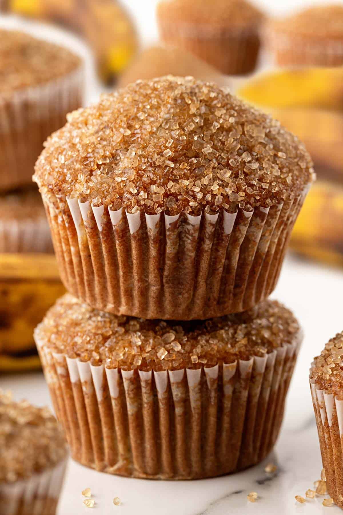 Stack of two banana muffins with crunchy sugar tops