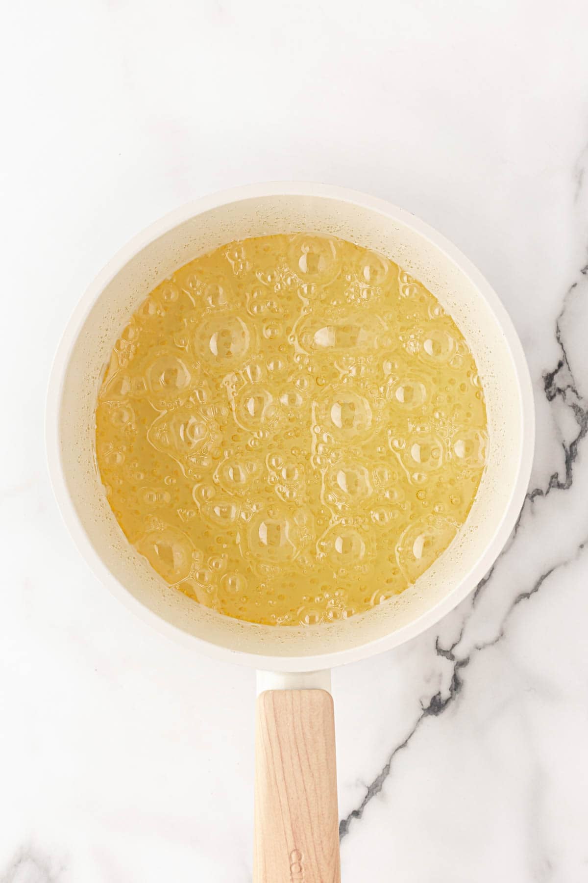 Candy mixture bubbling in a saucepan as it cooks
