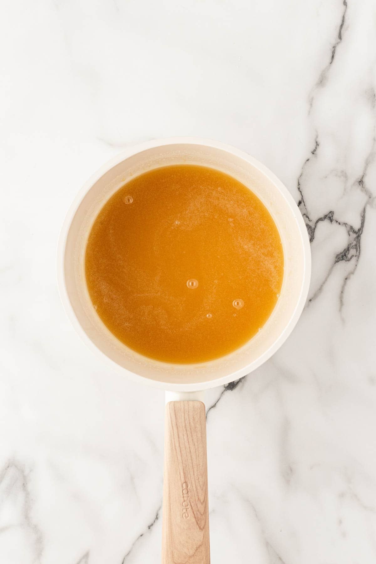 Honey butter glaze in a small saucepan