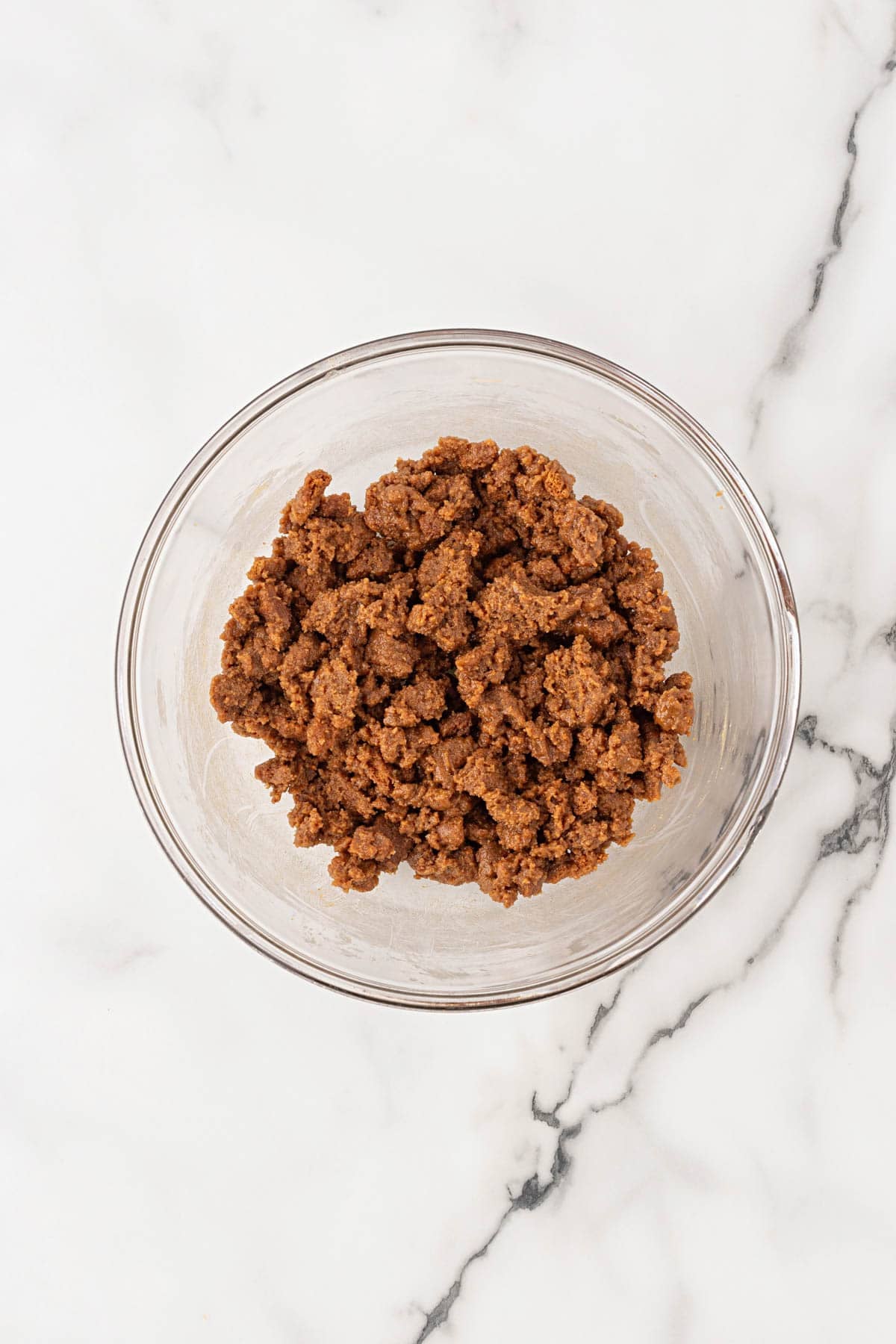 Biscoff crumble mixture in a glass bowl