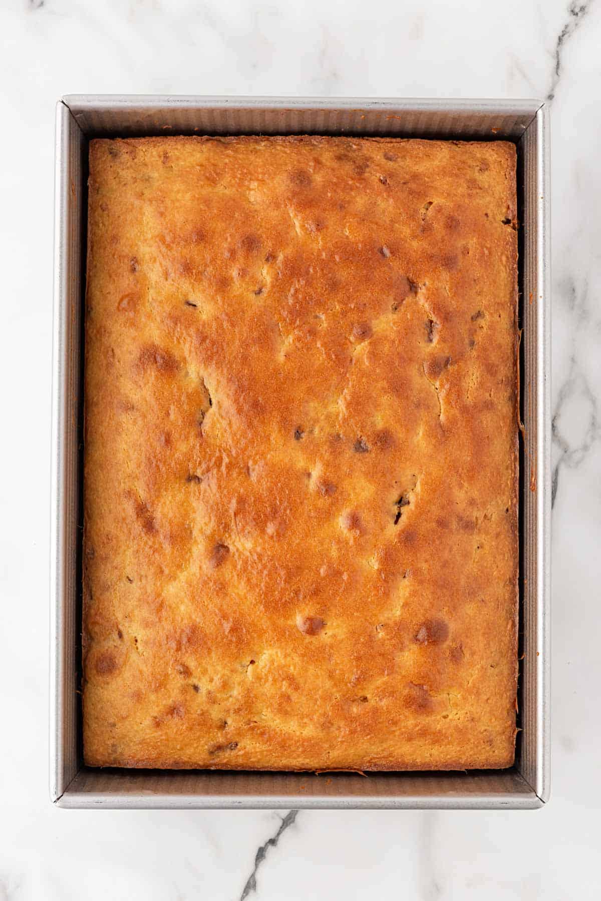 Freshly baked Biscoff honey bun cake in a baking pan